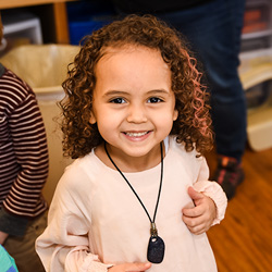 Girl smiling with whistle around her neck